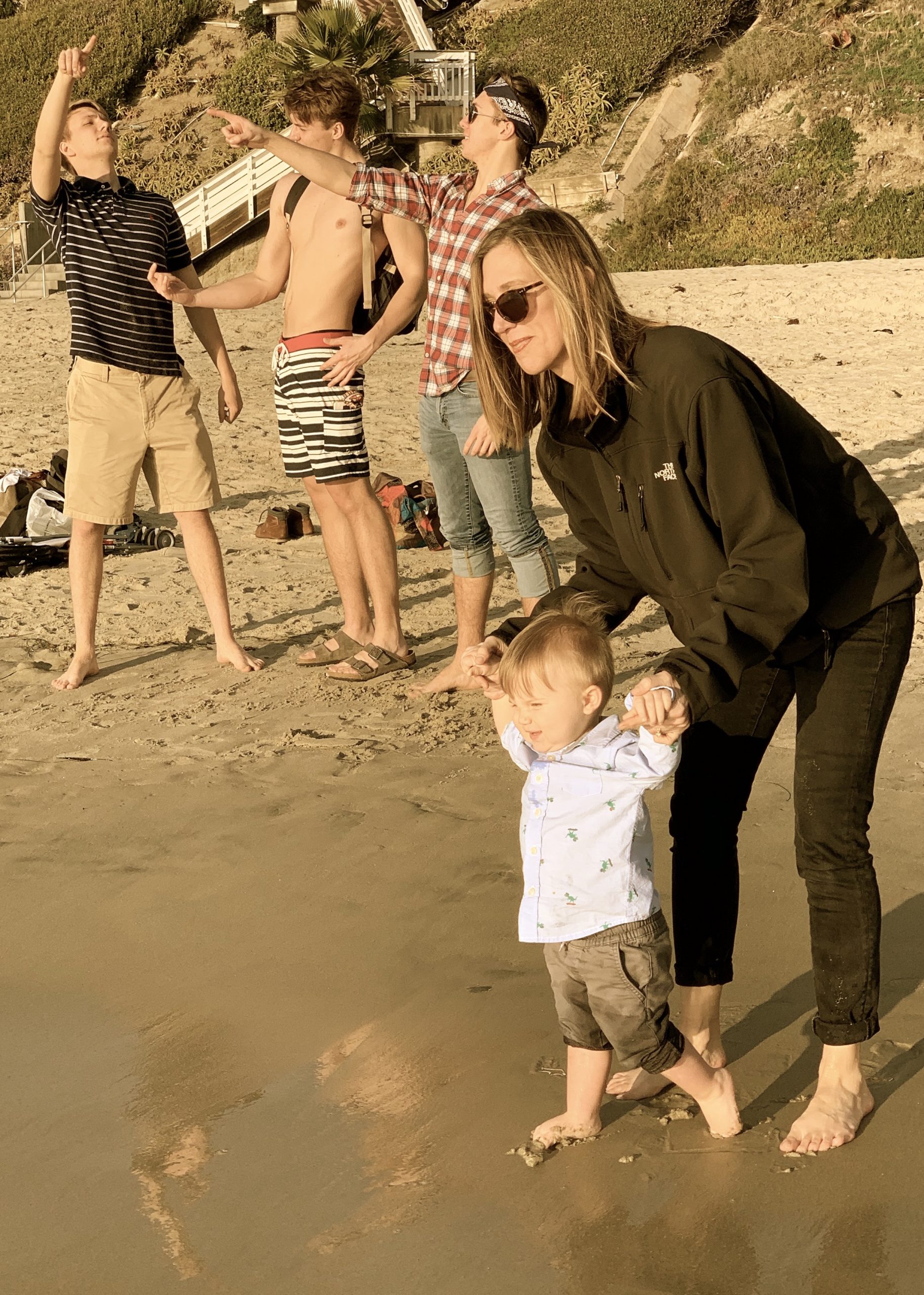 Julie and Liam, with our boys photobombing in the background, in California, 2020.